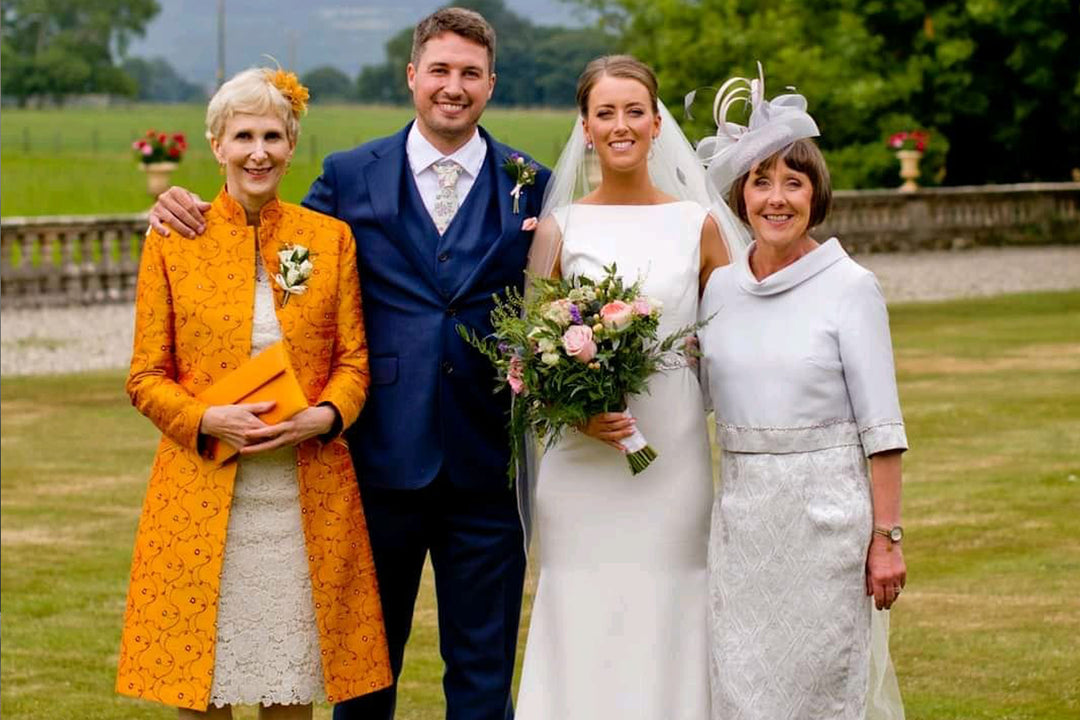 Mother of the bride wearing Shibumi Yellow Coat. 