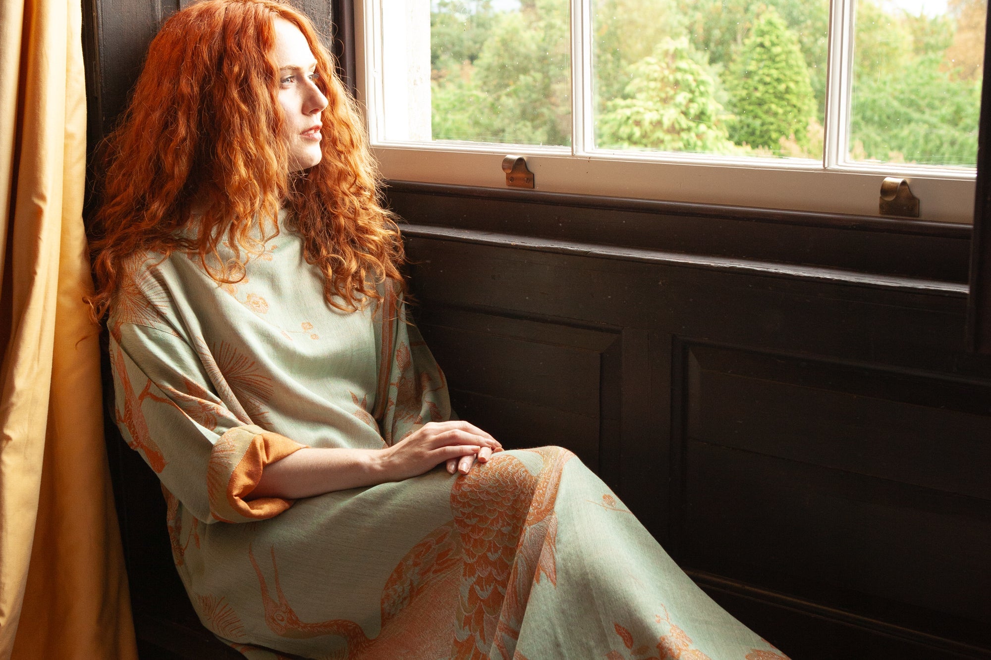 Cashmere kaftan in light green with orange floral and birds motif