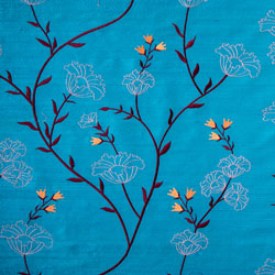 Silk fabric in turquoise with floral embroidery. 