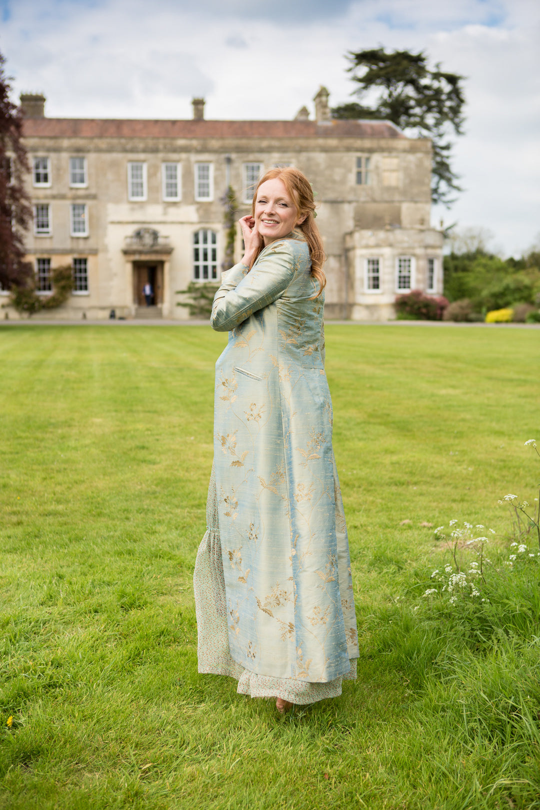 long silk silver bridal coat with embroidered gold flowers