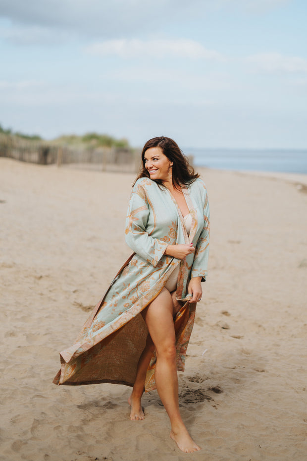 Swimming pool outfit. Luxury beach cover. Long gown in green and orange. 