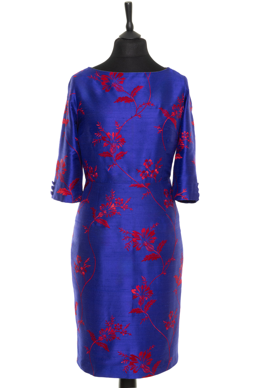 Bateau neck silk dress in blue cobalt with vibrant red embroidery. Longer sleeve silk dress that is fitted around the waist. 