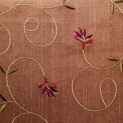 Silk brown fabric with red and yellow flowers. 