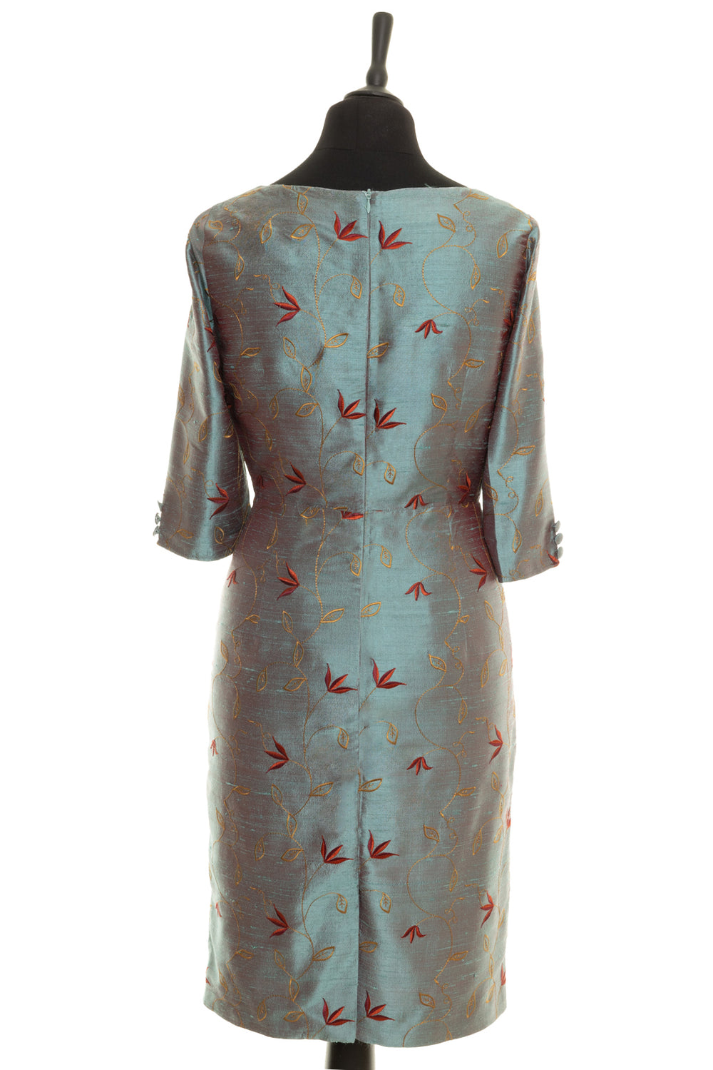 Back of a Shibumi Sophia dress in Paris. Smokey blue dress for mature ladies with floral embroidery. 