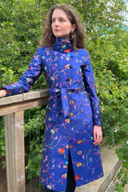 Classic trench coat. Blue silk with embroidered flowers. Wedding guest outfit. 