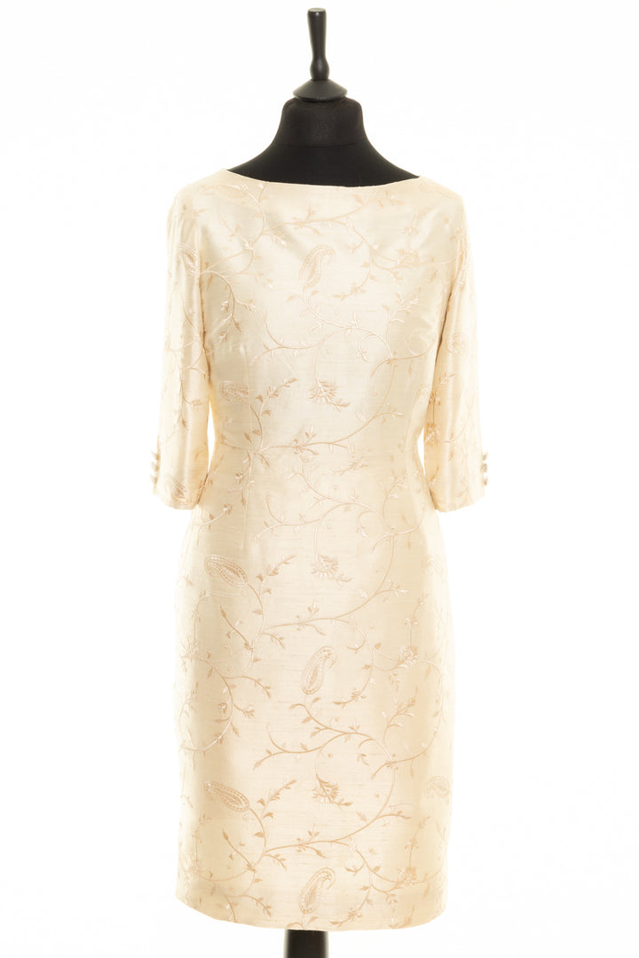 Silk ivory dress that would be a lovely bridal dress for a mature bride. It has longer sleeves and floral embroidery. Shift knee length dress. 