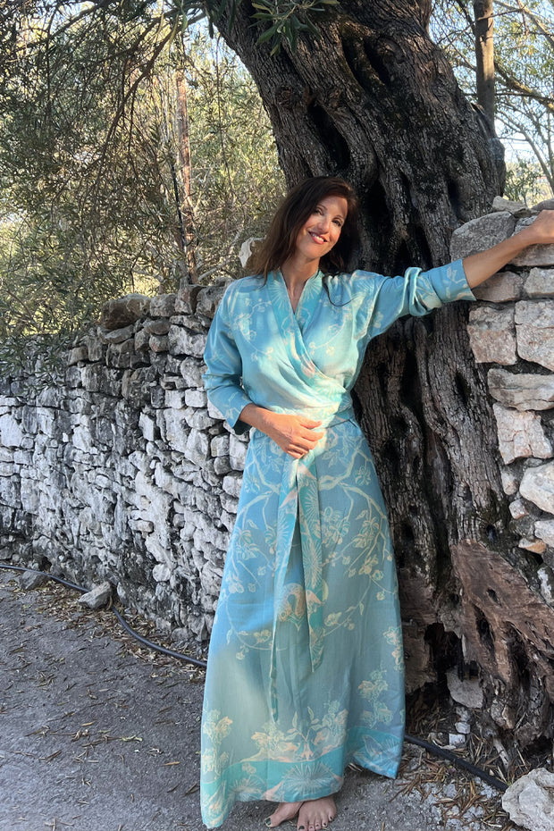 Belted kimono dress in light blue with floral pattern. 