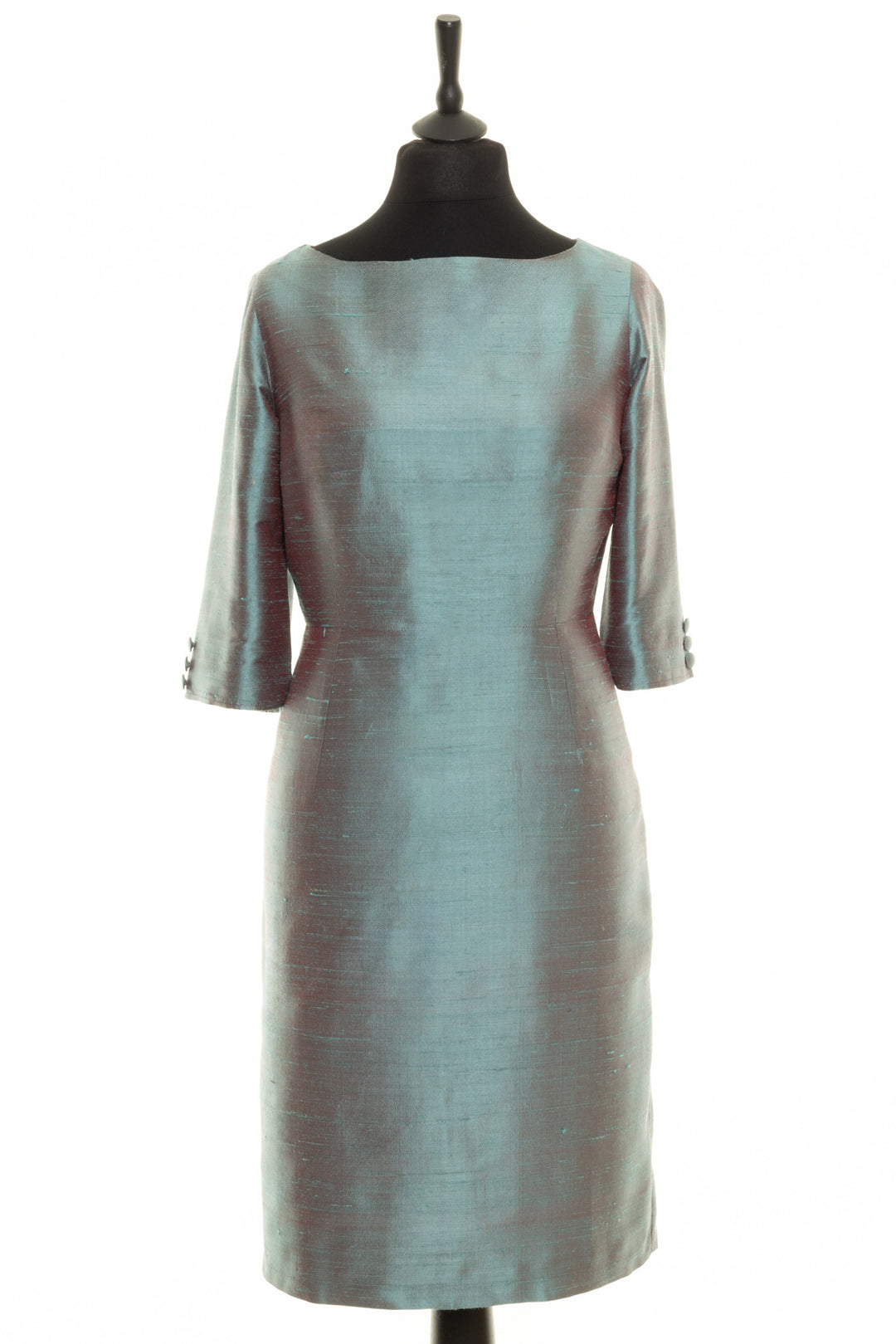 Shibumi silk dress with bateau neck. Knee length dress that is fitted around the waist. Made from raw silk. 