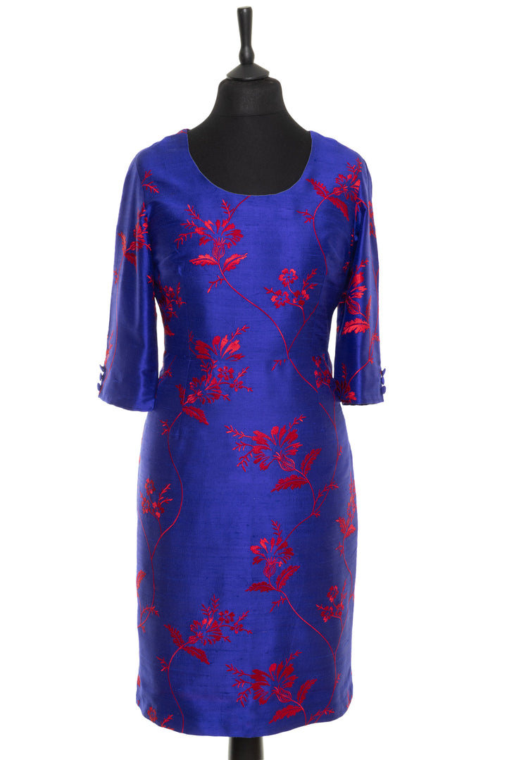 VIbrant blue cobalt dress with big red floral pattern. This is a knee lenght shift women's dress with sleeves and 3 button detail. Dress for mother o the groom and over 50s. 