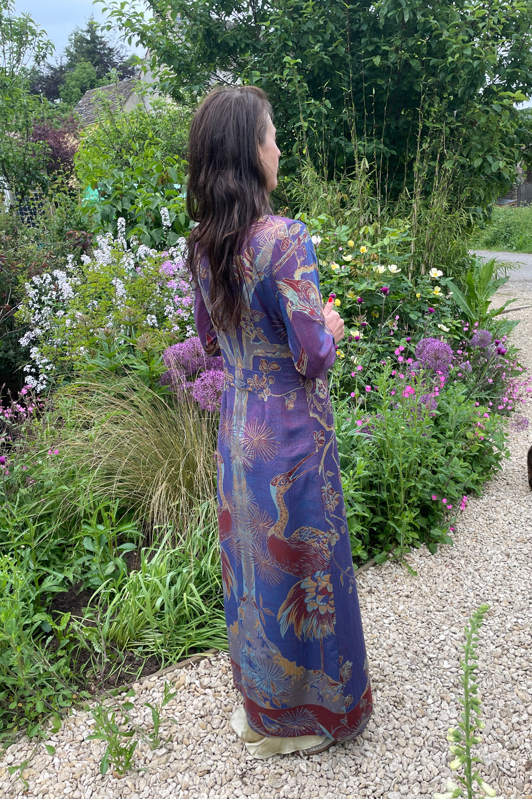 Long purple and blue coat with tree of life and floral pattern. The perfect wedding guest outfit. Long silk dress.