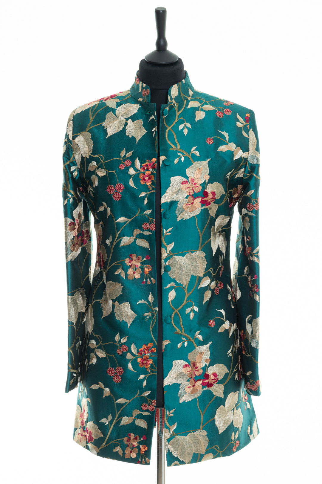 Long nehru jacket for women. Jacket with high collar in green silk with busy floral pattern. 