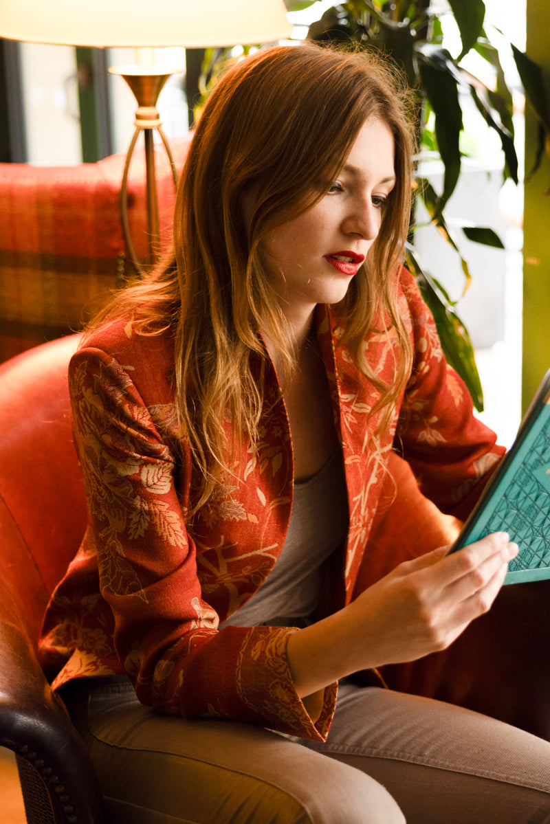 orange cashmere jacket worn with jeans