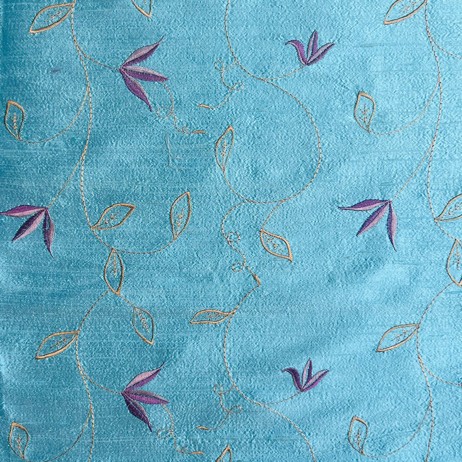 light blue silk fabric with soft floral design