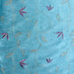 light blue silk fabric with soft floral design