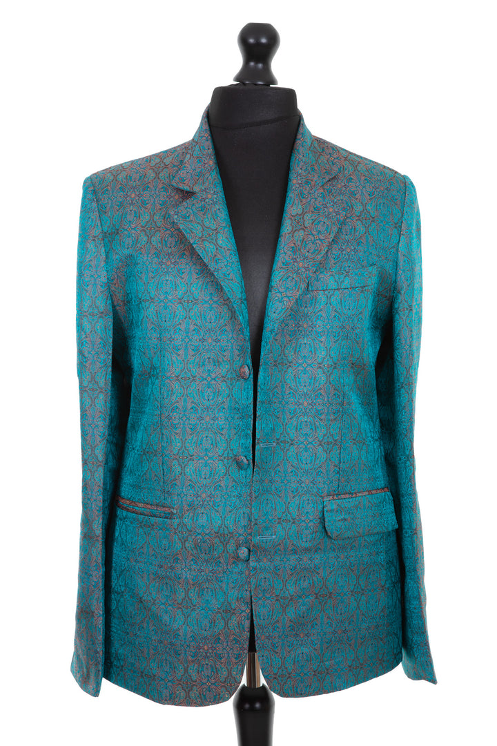 Mens silk blazer jacket with a revere collar in a dark teal jacquard embroidered raw silk with pink, blue, gold and black detail