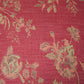 red fabric with green flower pattern 