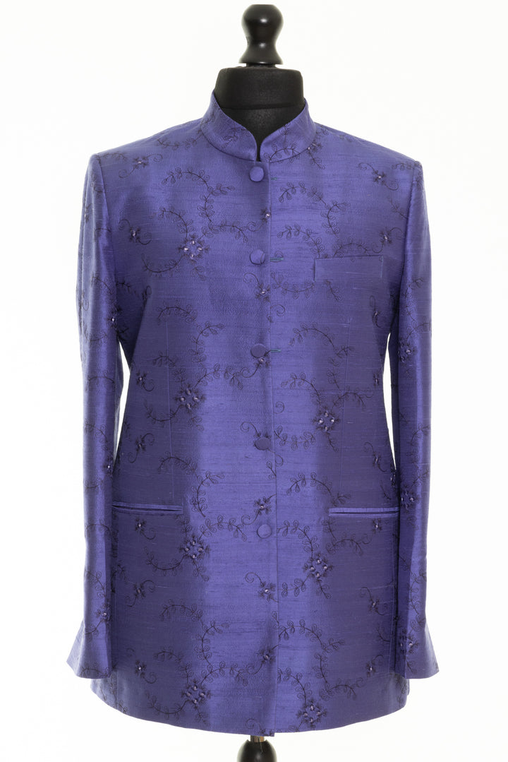 Luxurious handmade silk jacket with embroidered Nehru collar, perfect for weddings and special events. This is a classic mandarin style men's jacket in periwinkle with floral embroidery. 