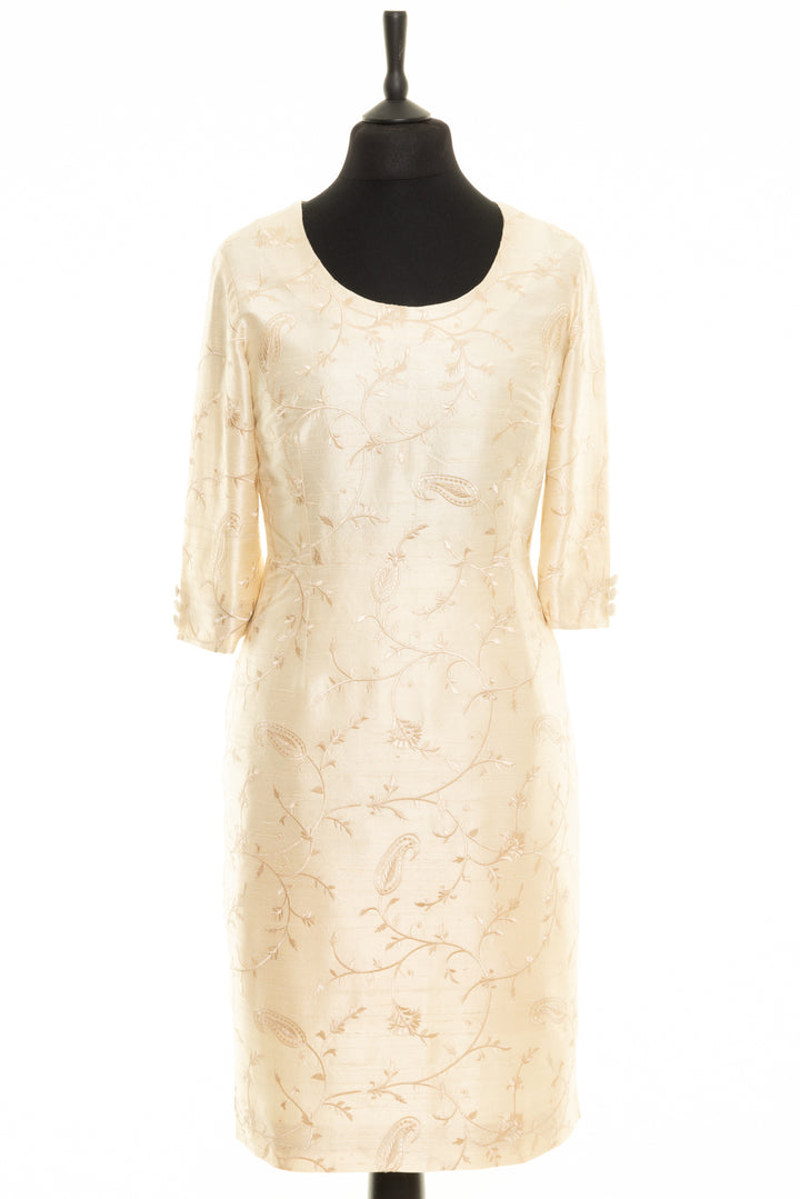 Wedding dress for a mature bride. Silk ivory dress with floral embroidery. This bridal dress has long sleeves and round neck. 