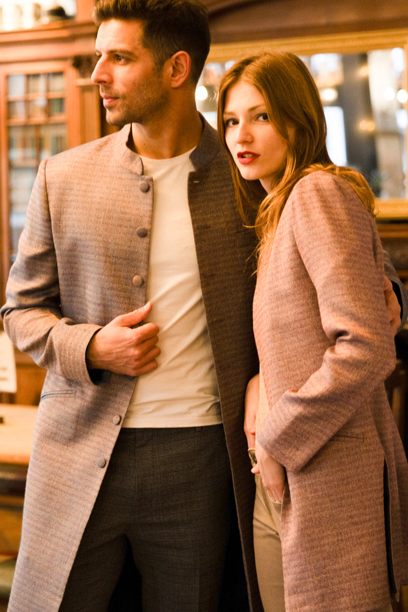 man and women wearing beautifully tailored coats, men's shiva coat in antique blue