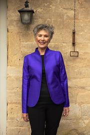 Short women's jacket in deep violet colour. Older lady wearing a silk elegant jacket in purple. Mother of the groom jacket. 