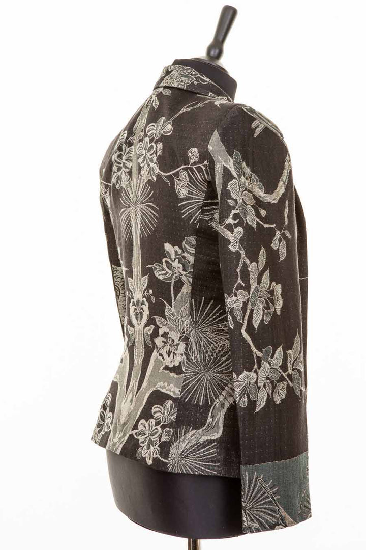 Black short women's jacket made from cashmere with floral pattern. 