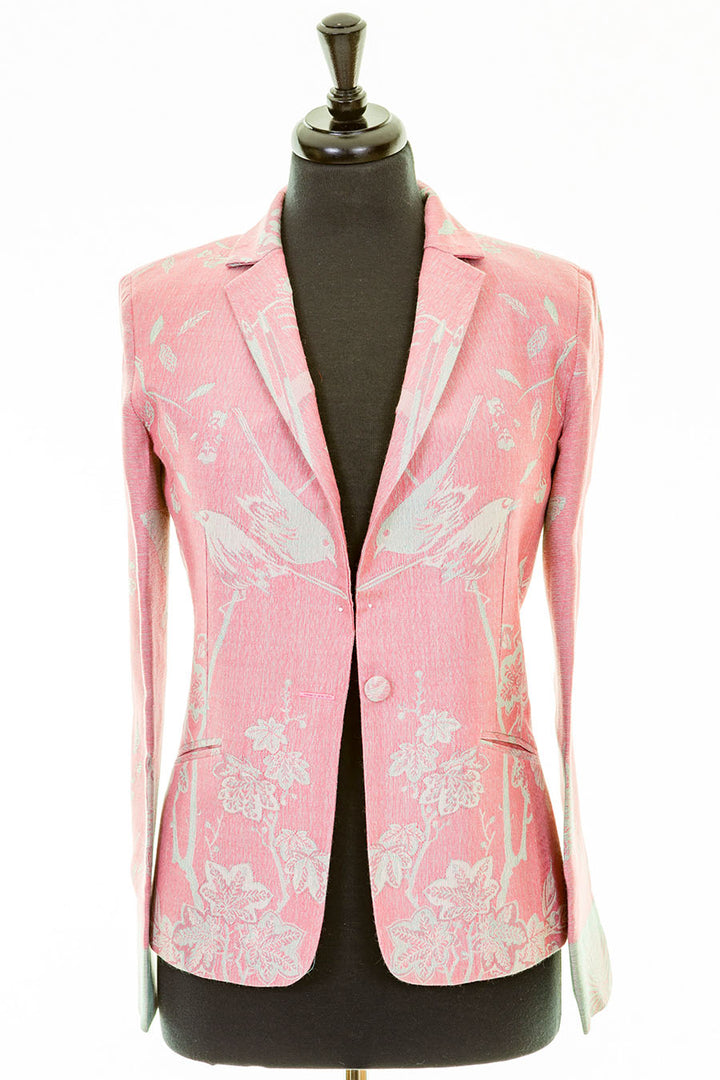 Soft pink coloured fitted jacket for women. This jacket has white birds and flowers in symmetrical pattern. 