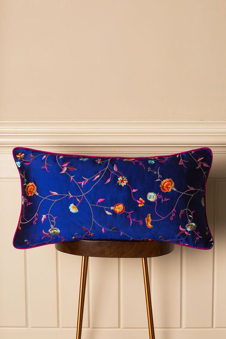 Bolster Silk Cushion in Navy with embroidered flowers. 