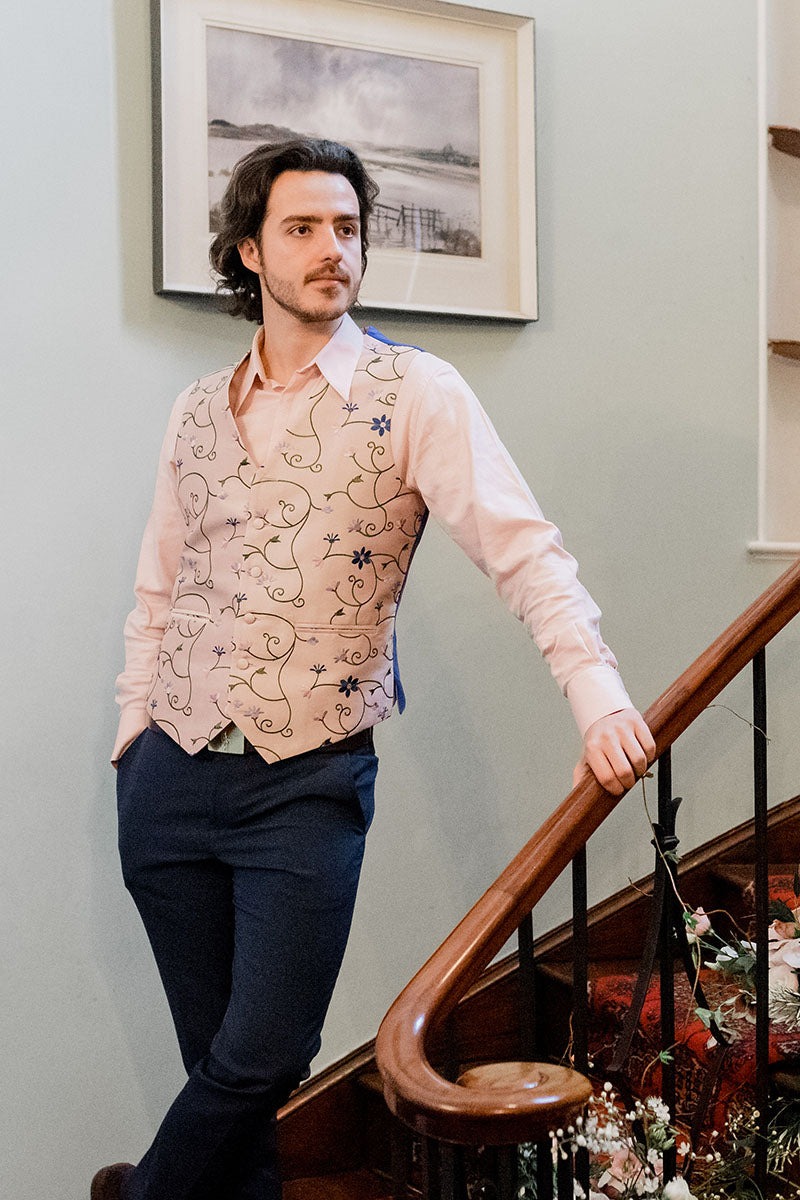 Smart waistcoat worn by groom. Soft pink silk with embroidery. Floral pattern with two pockets. 