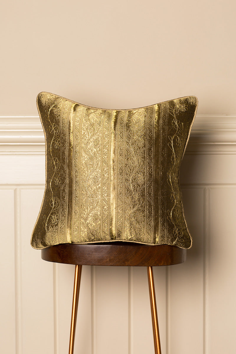 Golden silk sofa cushion. English country house interior design. 