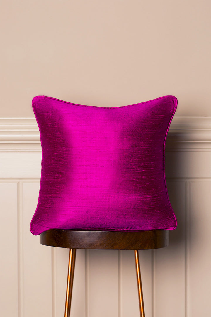 Raw silk armchair cushion in wild orchid. 