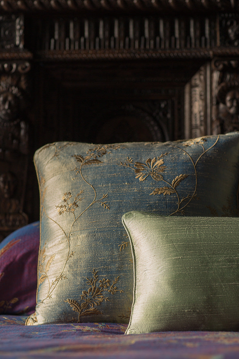 Bed cushions in soft colours made from luxury silk and embroidered silk. 