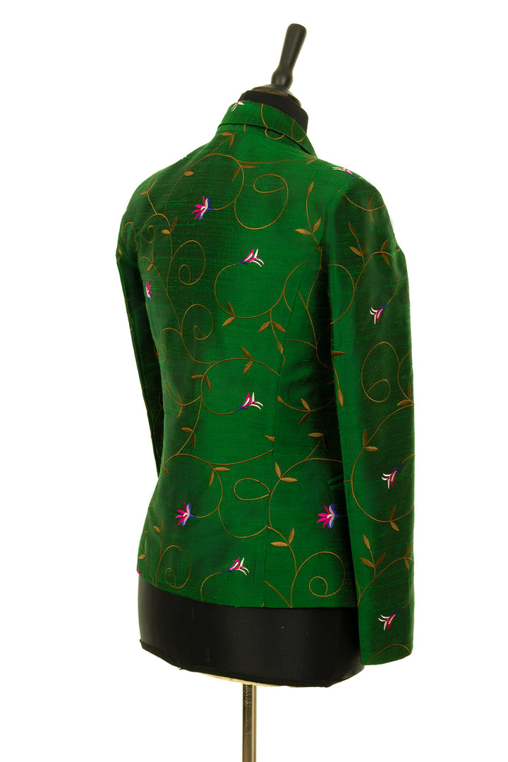 Green fitted silk suit for women. 