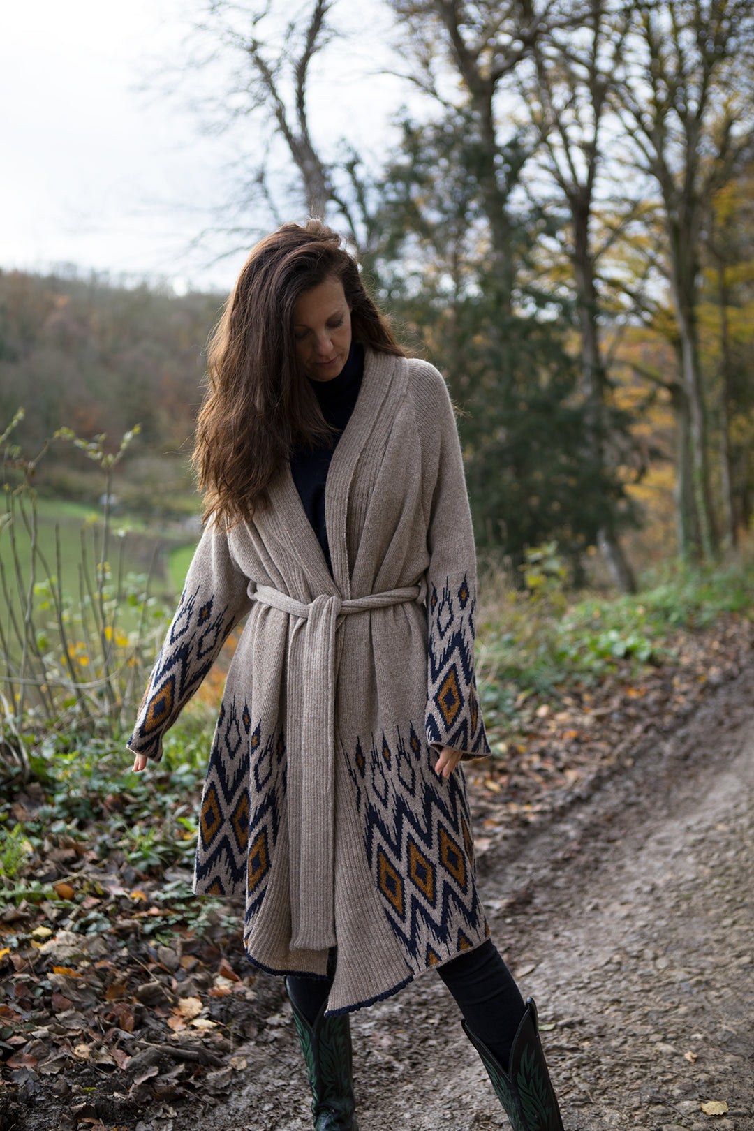 Woman wearing wool cosy cardigan on her walk. 