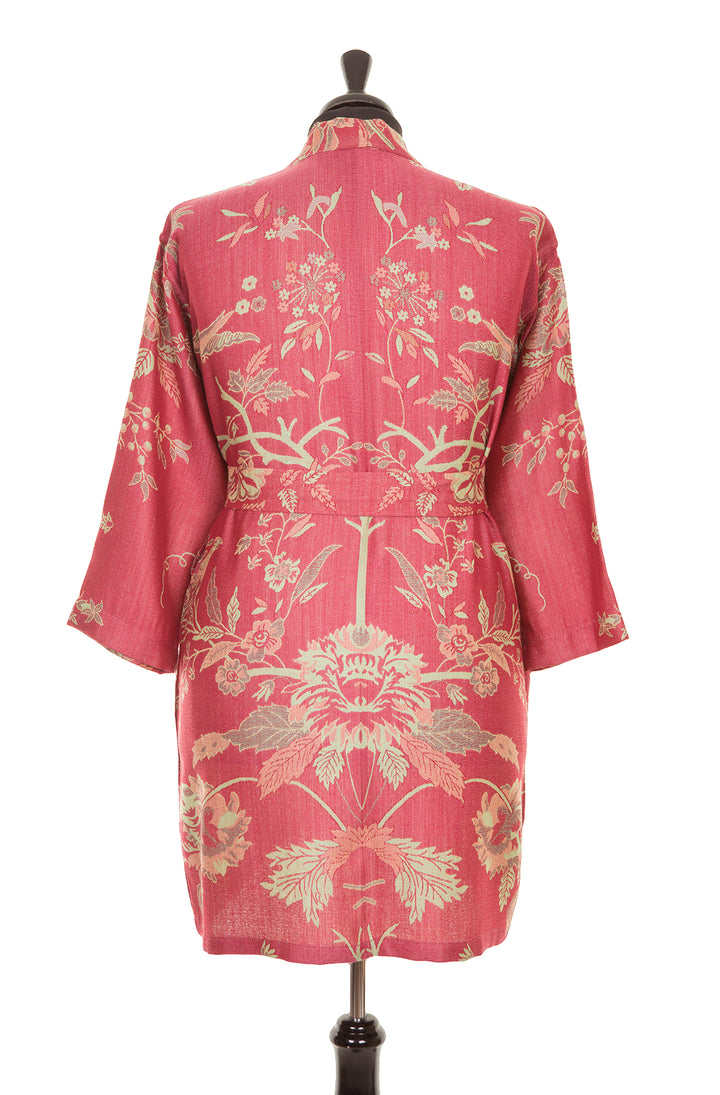 Dark pink belted kimono with floral pattern. 