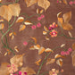 Brown silk fabric with colorful embroidery . 