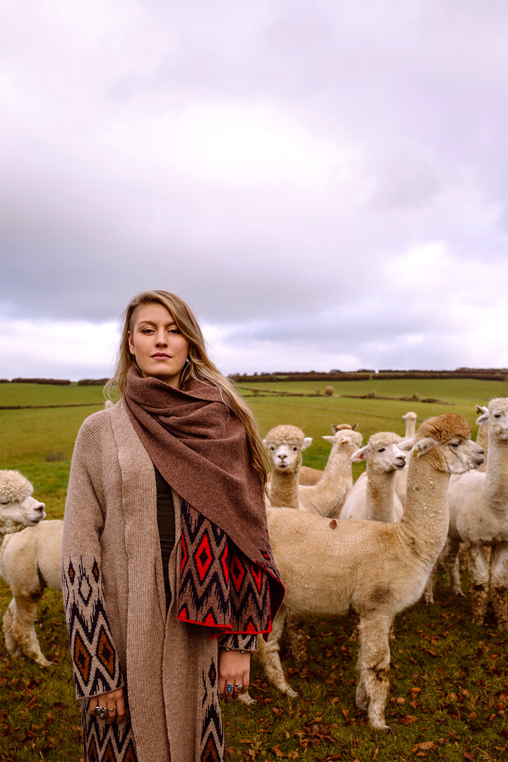 Women wearing wool scarf in aztec design. 